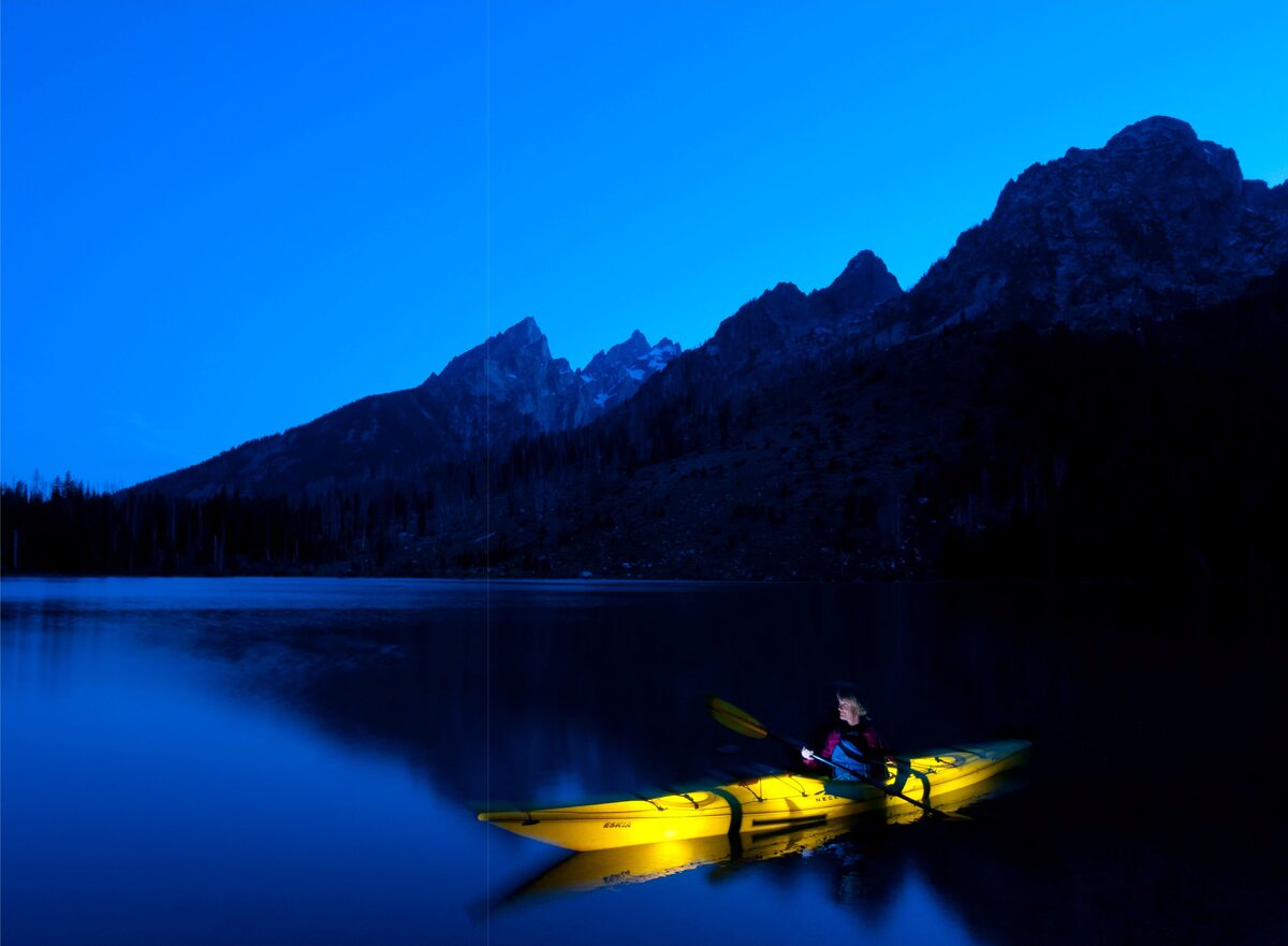 Sea kayaking on String Lake in Grand Teton National Park. The kayak was illuminated by three speedlights placed inside the boat and triggered with wireless transmitters. Nikon D300S, AF-S DX Zoom-Nikkor 12-24mm f/4G IF-ED. Exposure: 1/13 sec., ƒ/13, ISO 200.
