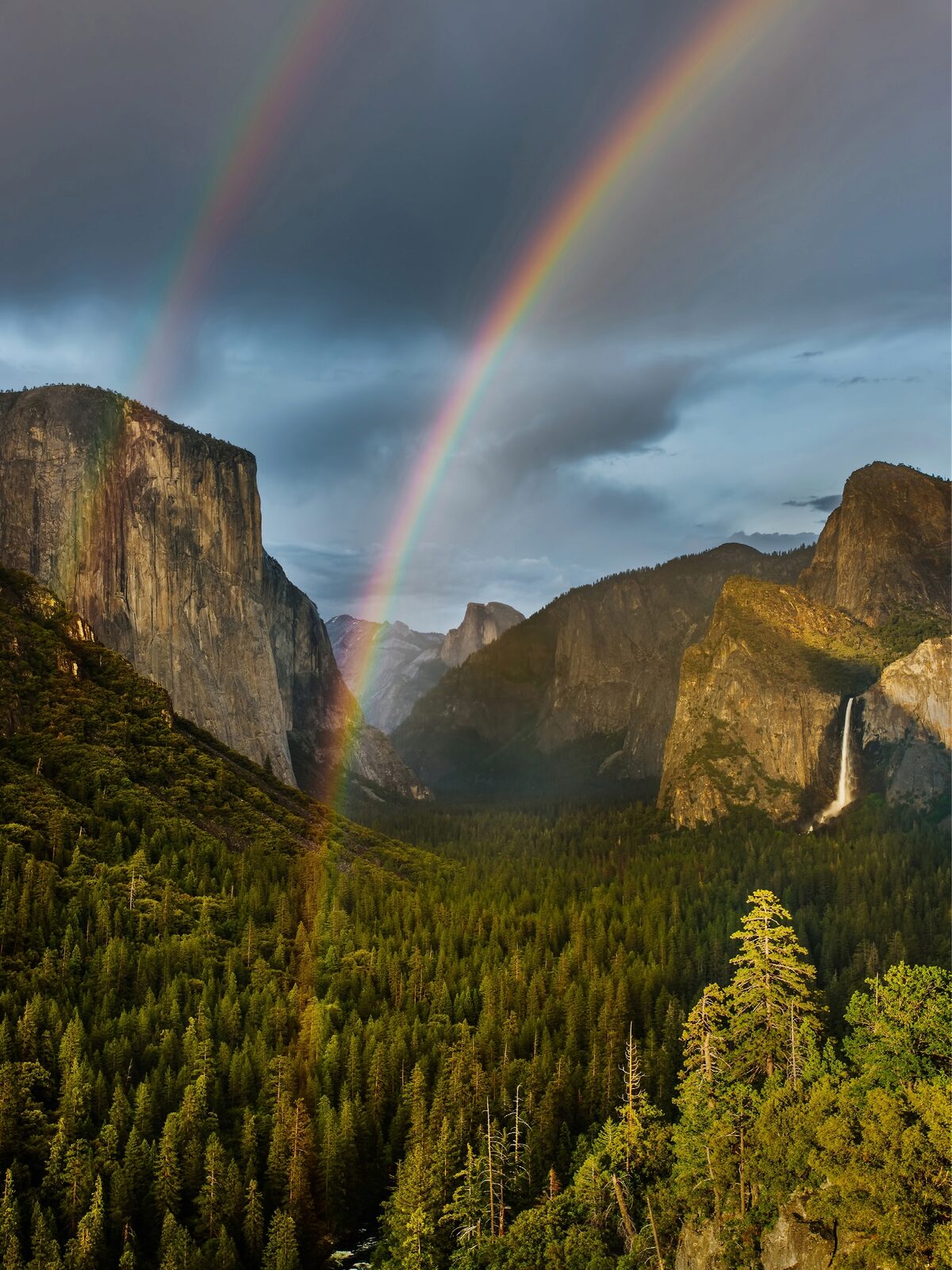 Double Rainbow, Yosemite Valley. Knowing that a rainbow was possible, I changed my plans and waited in a downpour for the sun to come out.