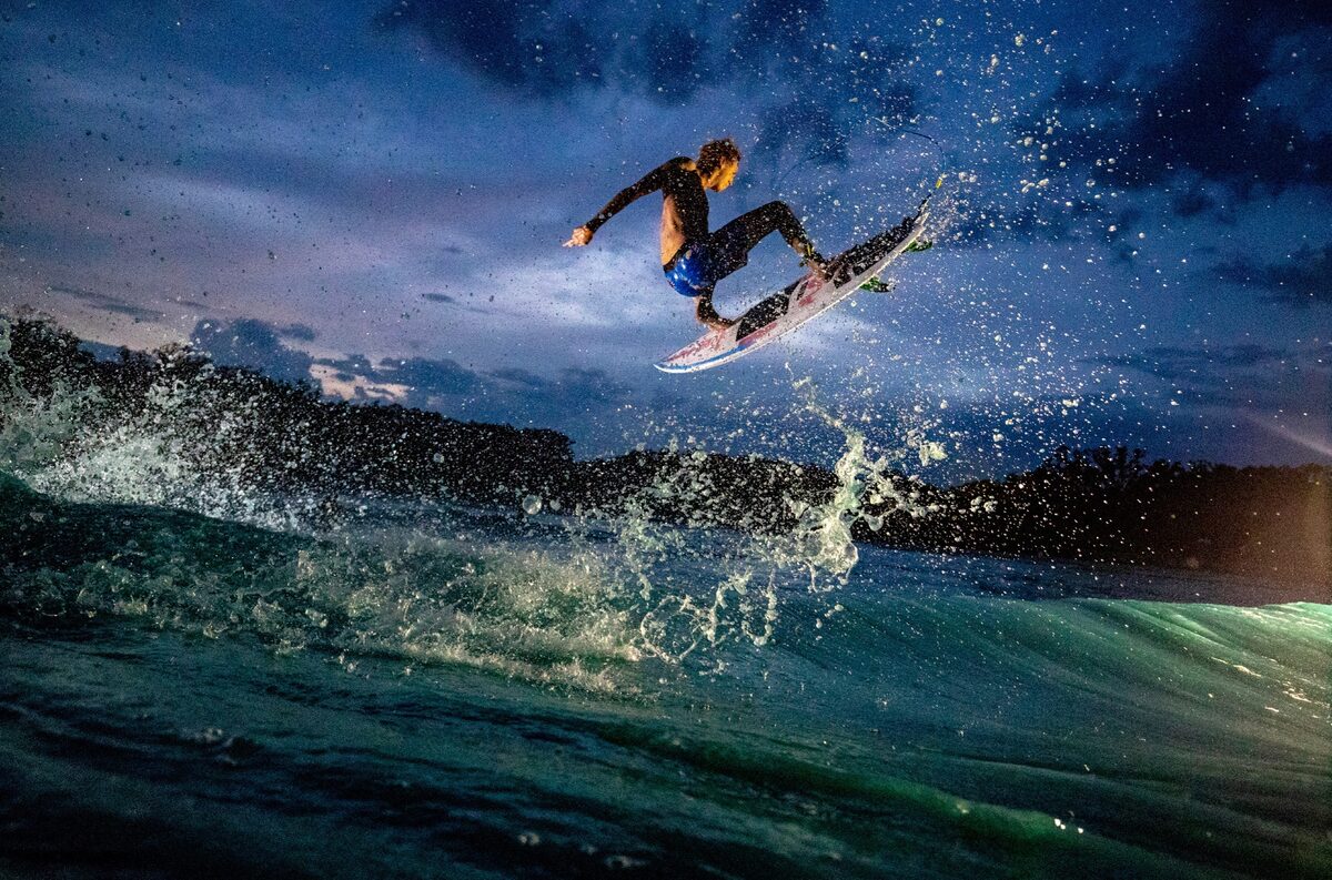 Ford Archbold with big air in the middle of Texas in a man-made wave pool. Utilizing several handheld lights, we were able to illuminate Ford as he flew through the Texas night.