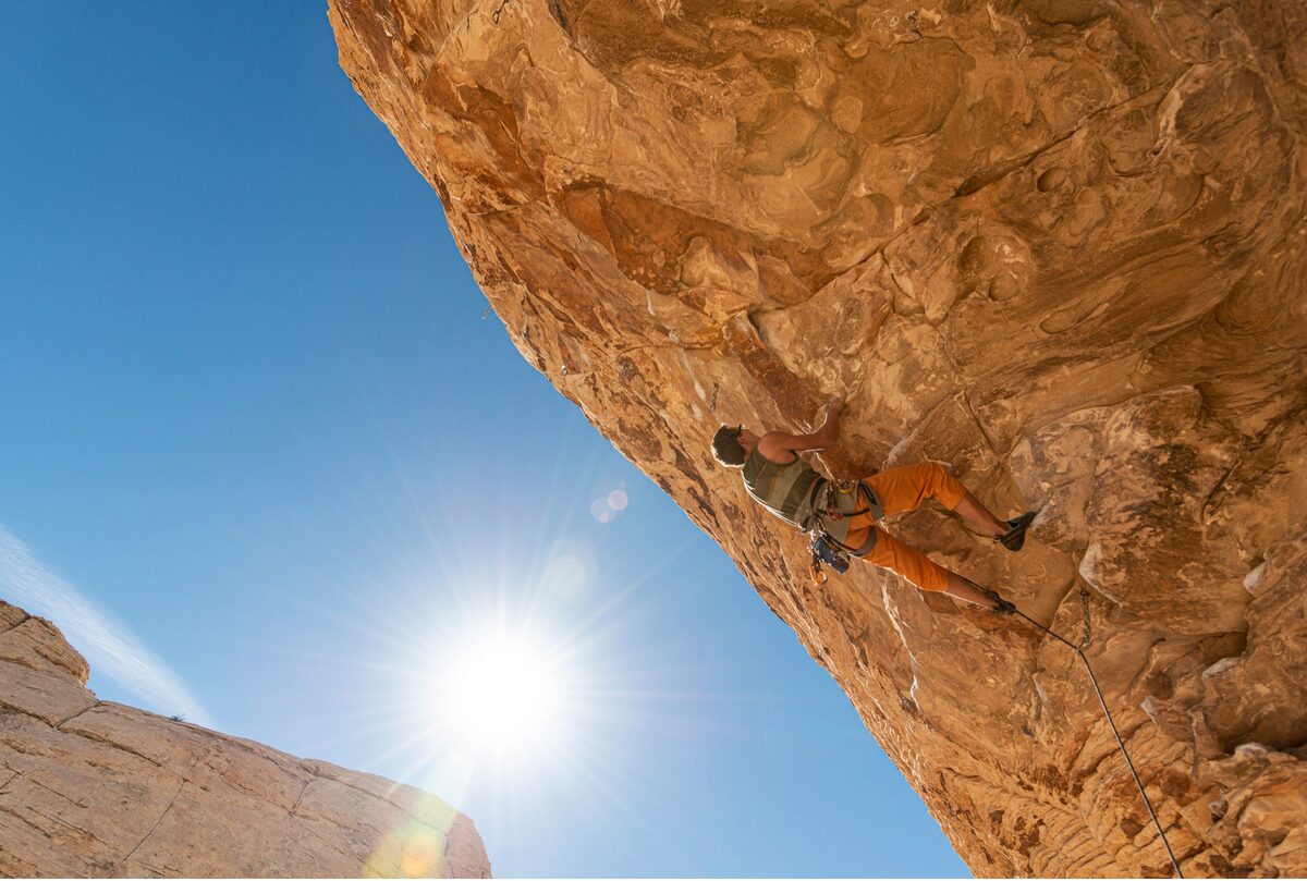A rock climber climbing a steep roof in Red Rock, Nevada. Nikon D800, AF-S NIKKOR 24-70mm F2.8G ED. Exposure: 1/1250 sec., ƒ/5.6, ISO 200.