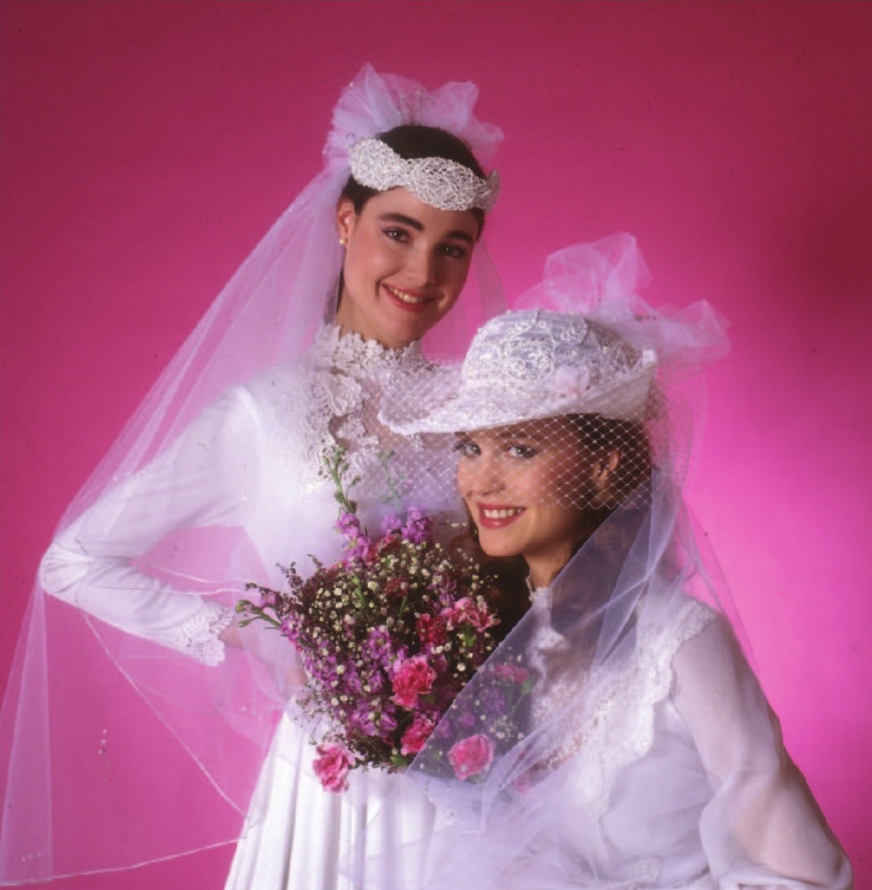 two women in white dresses