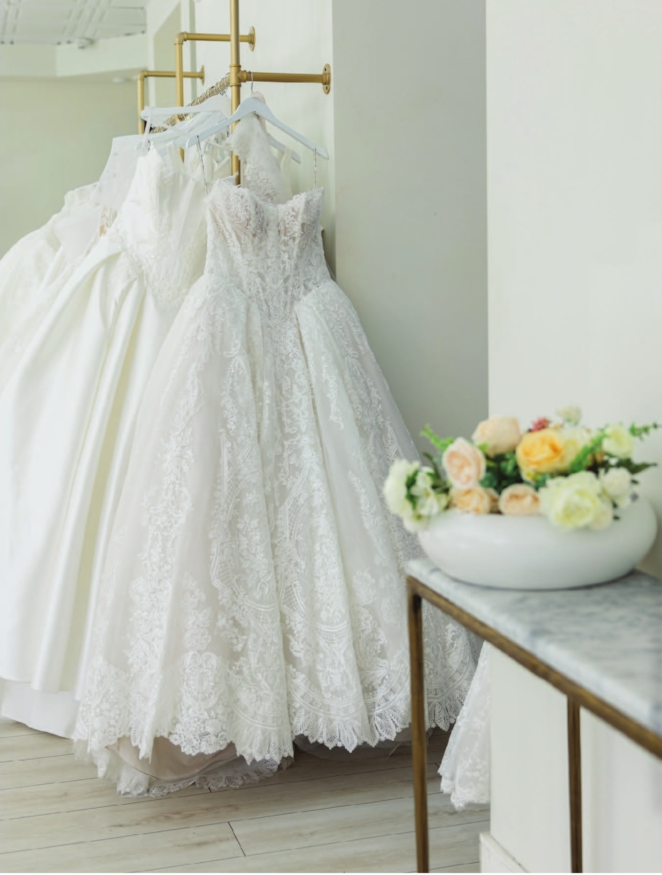 a group of wedding dresses on swingers