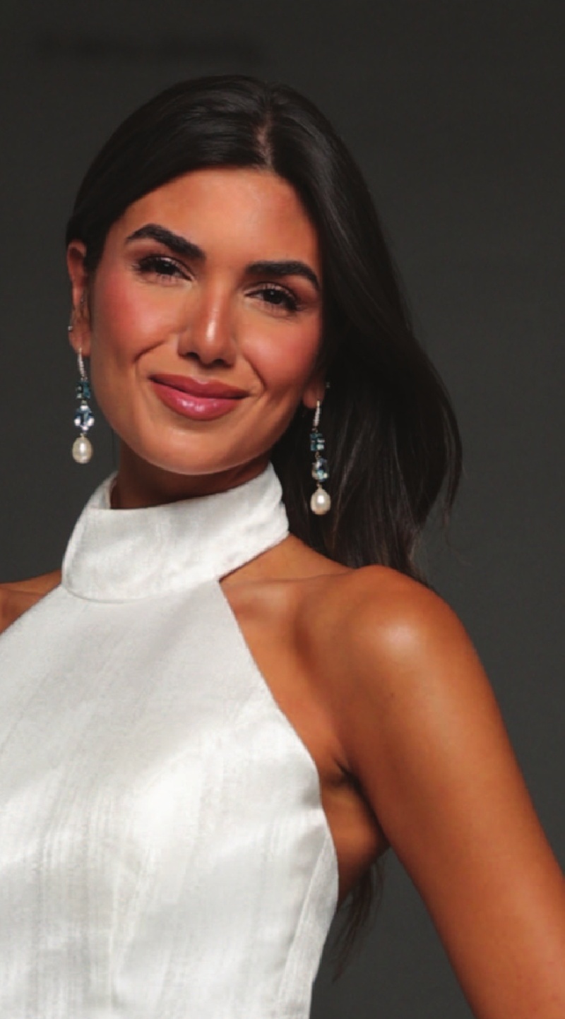 a woman wearing a white dress