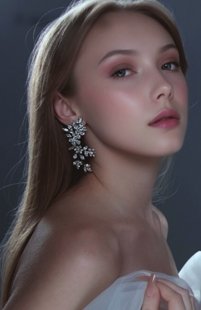 a woman with long hair and a large earring