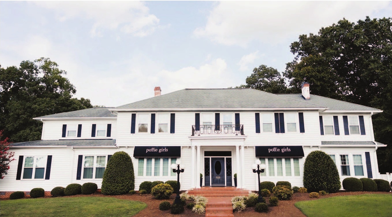 a white house with a blue door