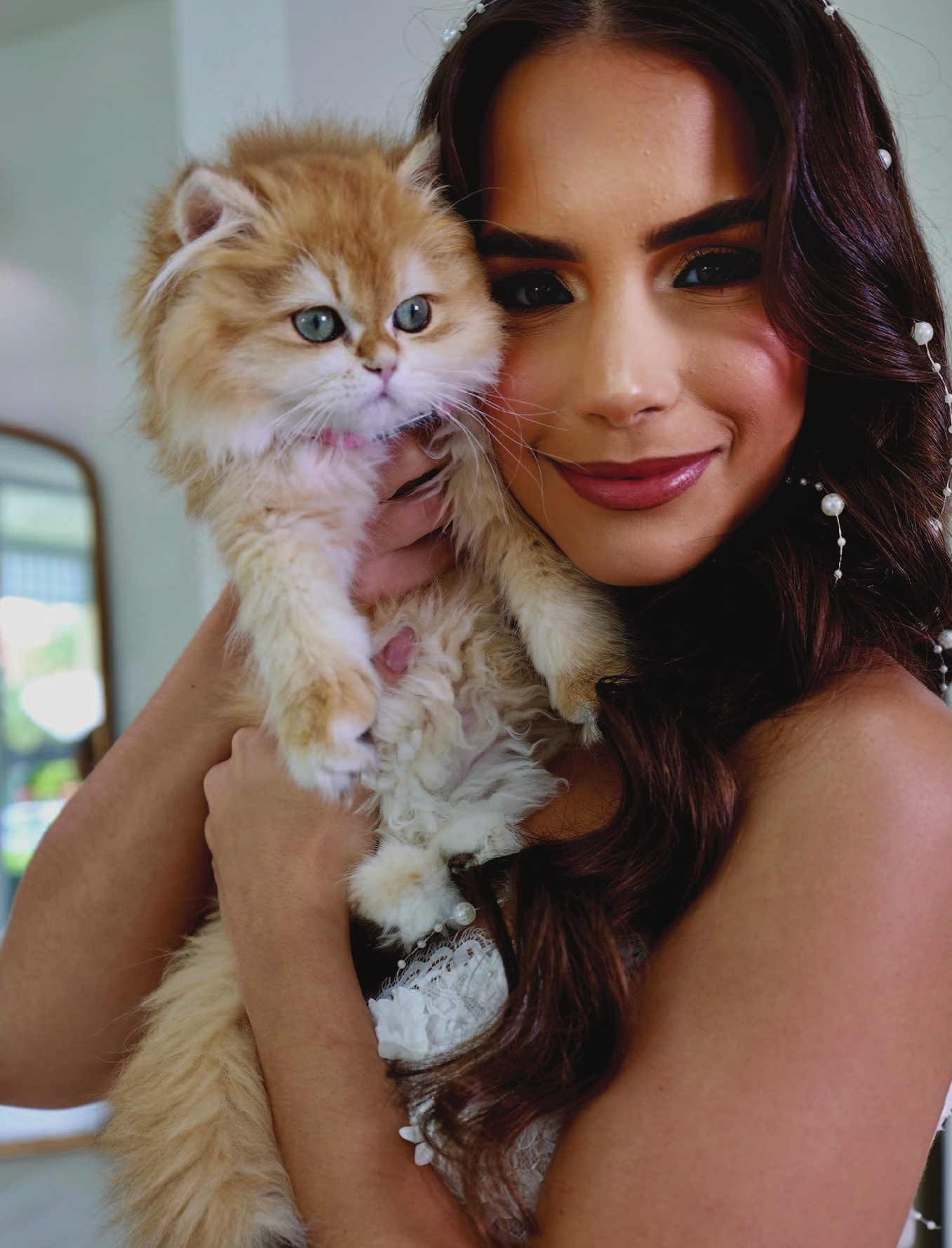 a woman holding a cat